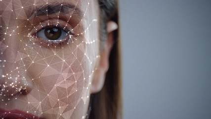 face id. future. half face of young caucasian woman for face detection. brown female eye biometrical