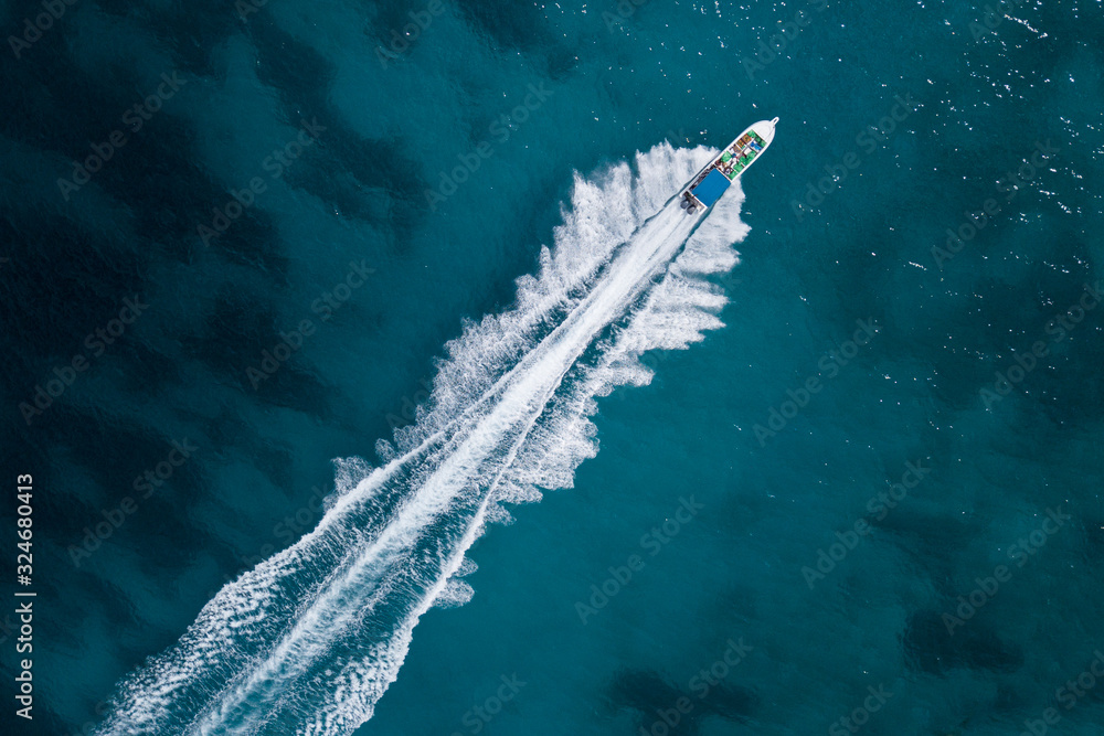 Bird eye view of motor boat with wake at sea Stock Photo | Adobe Stock