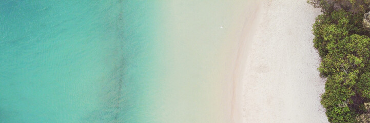 Aerial view of beautiful turquoise sea ocean, beach and tree forest walk, Top view from drone, World Oceans Day, reopen tourism