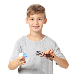 Poster - Little boy with contact lens case and eyeglasses on white background