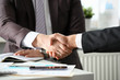 © H_Ko - Man in suit shake hand as hello in office closeup. Friend welcome mediation offer positive introduction greet or thanks gesture summit participate approval motivation strike arm bargain concept