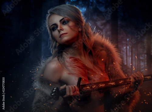 Fotomural Beautiful naked woman with blood stained skin holding a long sword in night forest