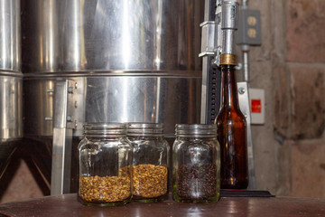 Glasses filled with different malts and hops