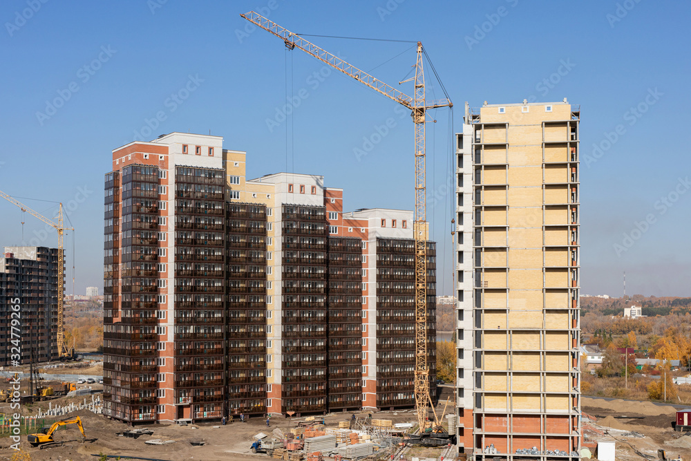 Construction of high-rise residential building. cranes working on ...