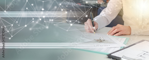 Photo Client signing a real estate contract; panoramic banner