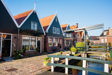 Wall Mural - Volendam old town, Netherlands. Picturesque street in village in Waterland district near Amsterdam. Popular travel destination and tourist attraction