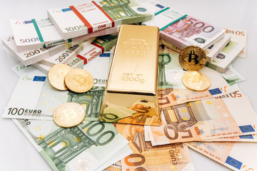 Wall Mural - Bitcoin BTC Gold coins with bills of euro banknotes and gold bullion. Bitcoin and gold lie on Euro banknotes