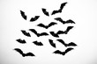 © Adil - Halloween paper decorations concept. Black paper bats on a white background. Halloween concept.