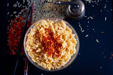 Wall Mural - rice with saffron on a dark background