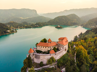 Wall Mural - Aerial view of Bled Castle overlooking Lake Bled in Slovenia, Europe.