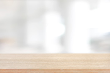 Wood table top on blurred white background