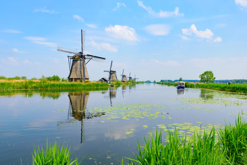 Wall Mural - The windmills and the reflection on water in Kinderdijk, a UNESCO World Heritage site in Rotterdam, Netherlands