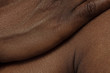 © master1305 - Hand. Detailed texture of human skin. Close up shot of young african-american male body. Skincare, bodycare, healthcare, hygiene and medicine concept. Looks beauty and well-kept. Dermatology.