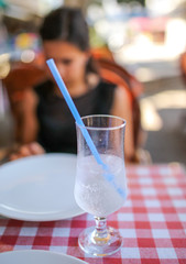 Wall Mural - A glass of cold water with ice on the table