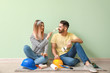 © Pixel-Shot - Happy young couple resting during repair in their new house