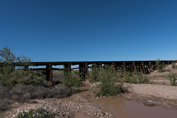 Wall Mural - Mimbres river railroad trestle and blue sky.