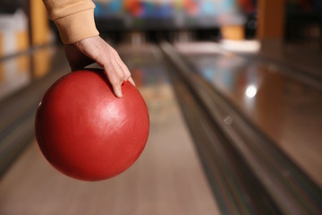 Canvas Print - Man with ball in bowling club, closeup. Space for text