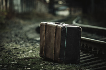 old suitcase near the railway