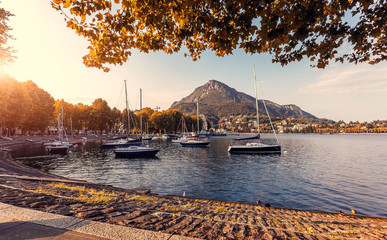 incredible evening scene in lecco town on como lake, during sunset. amazing colorful cityscape under