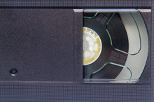 Stack Of VHS Video Tapes As Background. Old Video Cassette Tapes. Retro Technology.