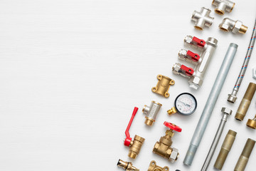 Canvas Print - Plumbing flat lay concept background with copy space. Various water system accessories on white background.