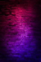 Neon Light On Brick Walls That Are Not Plastered Background And Texture. Lighting Effect Red And Blue Neon Background Of Empty Brick Basement Wall.