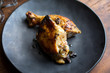 © Andrew Scrivani - Close up view of roasted chicken piece in plate