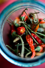 Close Up Of Dried Thai Chilies In Glass Jar