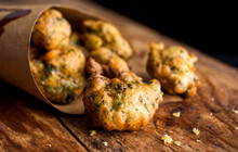 Selective Focus Of Tempura Herb Fritters On Wooden Surface