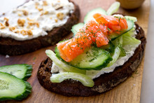 Selective focus of sandwich with goat cheese and cucumber