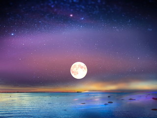 Starry blue night  moon sky at sea sunset background