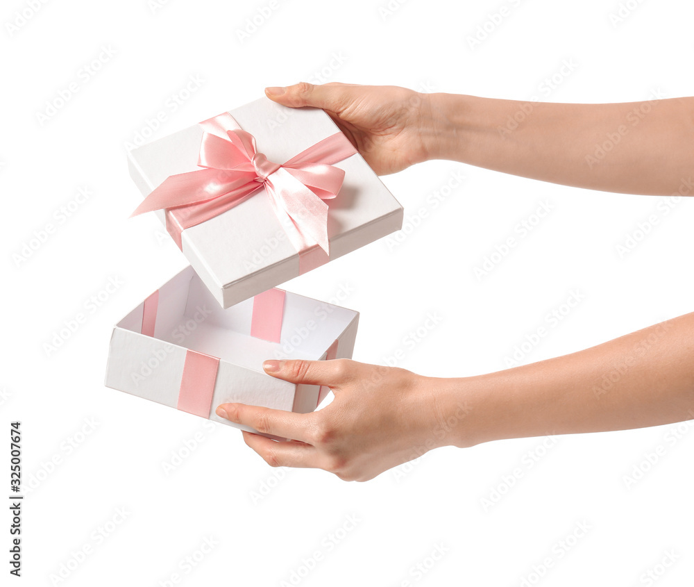 Female hands with beautiful gift box on white background