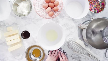 Sticker - Flat lay. Step by step. Mixing ingredients in standing kitchen mixer to make funfetti cake.