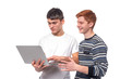 © rozaivn58 - Shot of two  teenager guys  engaging on a laptop and discussing something, isolated