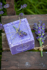 Wall Mural - Top view of natural lavender soap on old wooden chair