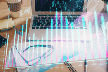 Double exposure of forex chart and work space with computer. Concept of international online trading.