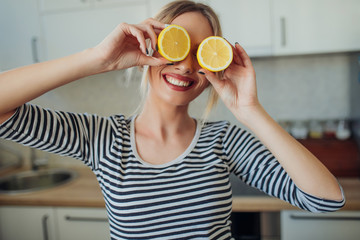 Young smiling woman with lemons