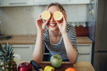 young smiling woman with lemons