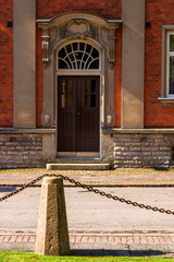 Poster - Door towards the street of an old apartment building