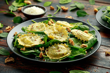 Wall Mural - Italian ravioli pasta stuffed with spinach, creamy ricotta cheese, walnuts. Healthy Vegetarian food