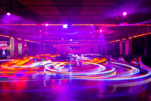 Blurry colourfull light lines from the fast moving bumper cars at the Sassenheim town fair in the Netherlands.