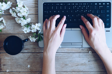 Working space with laptop spring flowers