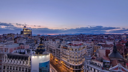 Wall Mural - Panoramic aerial view of Gran Via day to night timelapse, Skyline Old Town Cityscape, Metropolis Building, capital of Spain, Europe.