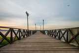 Fototapeta  - Romantic wooden walkway on the lake