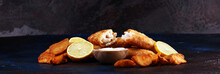 Traditional British Fish And Chips Consisting Of Fried Fish, Potato Chips And Mayonnaise