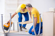 © Elnur - Two contractors carpenters working indoors