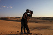 © BUDDHA - Romantic young couple kissing during the sunset at Sahara desert