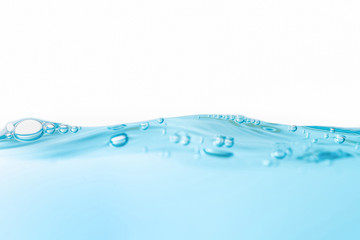 Air bubbles floating on motion wave. Water splash isolated on the white background.