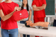 © Pixel-Shot - Woman with first aid kit at training course