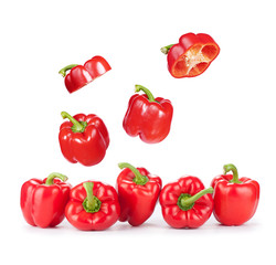 Wall Mural - Flying red sweet peppers isolated on white